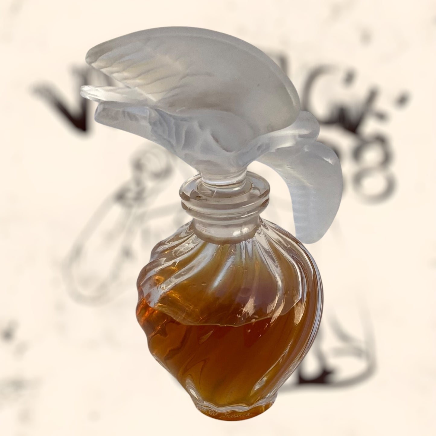 Frasco de perfume L’ Air Temp de Nina Ricci diseñado por Marc Lalique antiguo
